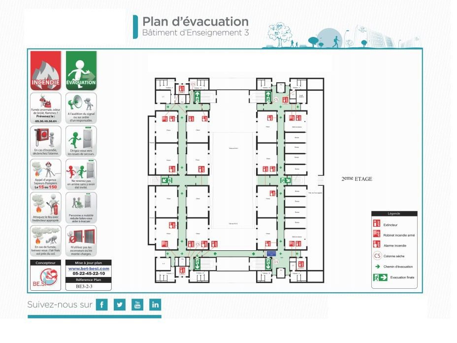 plan d'évacuation incendie affiché dans un couloir d'entreprise